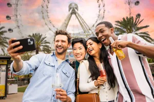 Double Date Selfie with drinks in front of The Orlando Eye
